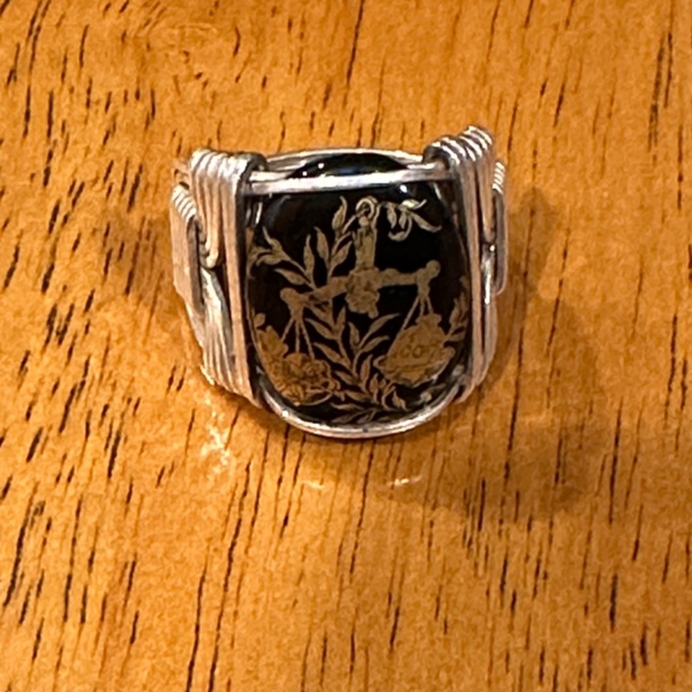 Black onyx and silver wrap Libra ring, size 7. Gold Libra scales.